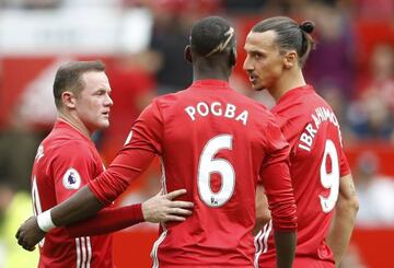 Having words: United's Wayne Rooney, Paul Pogba and Zlatan Ibrahimovic during the Manchester derby.