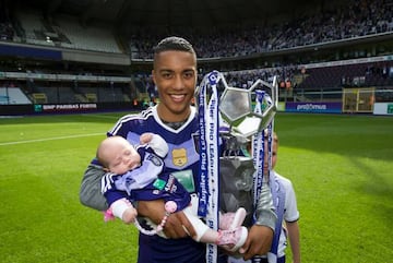 Anderlecht's Youri Tielemans and his daughter Melina pose with the trophy as he celebrates winning Anderlecht's 34th Belgian championship title