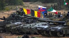 Tanks and military vehicles of NATO Enhanced Forward Presence battle groups stand together before live fire exercise, during Iron Spear 2022 military drill in Adazi, Latvia November 15, 2022. REUTERS/Ints Kalnins