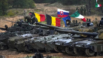 Tanks and military vehicles of NATO Enhanced Forward Presence battle groups stand together before live fire exercise, during Iron Spear 2022 military drill in Adazi, Latvia November 15, 2022. REUTERS/Ints Kalnins