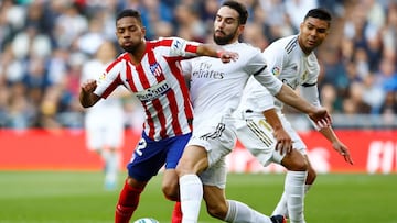 Soccer Football - La Liga Santander - Real Madrid v Atletico Madrid- Santiago Bernabeu, Madrid, Spain - February 1, 2020  Real Madrid&#039;s Dani Carvajal in action with Atletico Madrid&#039;s Renan Lodi   REUTERS/Juan Medina