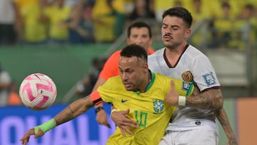 Brazil's forward Neymar (L) and Venezuela's midfielder Junior Moreno vie for the ball during the 2026 FIFA World Cup South American qualification football match between Brazil and Venezuela at the Arena Pantanal stadium in Cuiaba, Mato Grosso State, Brazil, on October 12, 2023. (Photo by NELSON ALMEIDA / AFP)