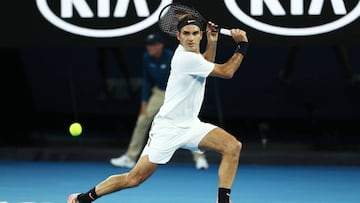 MELBOURNE, AUSTRALIA - JANUARY 16: Roger Federer of Switzerland plays a backhand in his first round match against Aljaz Bedene of Slovenia on day two of the 2018 Australian Open at Melbourne Park on January 16, 2018 in Melbourne, Australia. (Photo by Ry