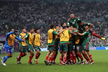 LUSAIL CITY, QATAR - NOVEMBER 30: Luis Chavez of Mexico celebrates with teammates after scoring their team's second goal   during the FIFA World Cup Qatar 2022 Group C match between Saudi Arabia and Mexico at Lusail Stadium on November 30, 2022 in Lusail City, Qatar. (Photo by Michael Steele/Getty Images)