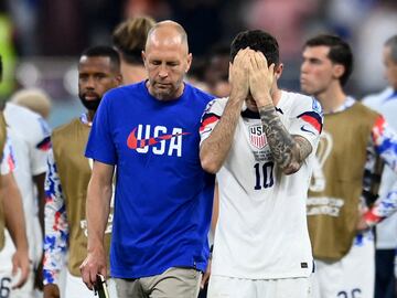 USA coach Gregg Berhalter and Christian Pulisic look dejected after they are eliminated from the World Cup.