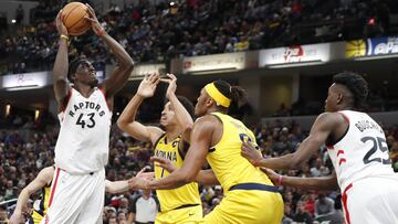Feb 7, 2020; Indianapolis, Indiana, USA;  Toronto Raptors forward Pascal Siakam (43) takes a shot against Indiana Pacers guard Malcolm Brodgon (7) and center Myles Turner (33) during the third quarter at Bankers Life Fieldhouse. Mandatory Credit: Brian Spurlock-USA TODAY Sports