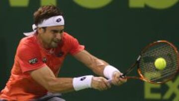 Spanish tennis player David Ferrer returns a ball Thiemo De Bakker of the Netherlands during their tennis match in Qatar&#039;s ExxonMobil Open on January 6, 2015, in Doha. AFP PHOTO / AL-WATAN DOHA / KARIM JAAFAR
 ==QATAR OUT==