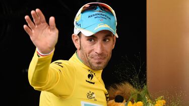 (FILES) In this file photo taken on July 6, 2014 Italy's Vincenzo Nibali celebrates his overall leader yellow jersey on the podium at the end of the 201 km second stage of the 101st edition of the Tour de France cycling race between York and Sheffield, no