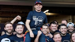 Red Bull's Max Verstappen celebrates after winning the constructors championship with teammates.