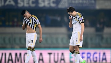 Juventus Argentinian forward #26 Carlos Alcaraz (L) and Juventus Italian forward #7 Federico Chiesa react at the end of the Italian Serie A football match between Hellas Verona and Juventus at the Marcantonio Bentegodi stadium in Verona on February 17, 2024. (Photo by MARCO BERTORELLO / AFP)