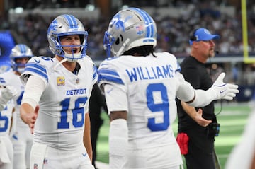 Oct 13, 2024; Arlington, Texas, USA;  Detroit Lions wide receiver Jameson Williams (9) celebrates with Detroit Lions quarterback Jared Goff (16) after catching a touchdown pass during the second half against the Dallas Cowboys at AT&T Stadium. Mandatory Credit: Kevin Jairaj-Imagn Images