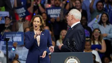 U.S. Vice President and Democratic presidential candidate Kamala Harris and her newly chosen vice presidential running mate Minnesota Governor Tim Walz react during a campaign rally in Philadelphia, Pennsylvania, U.S., August 6, 2024. REUTERS/Kevin Lamarque