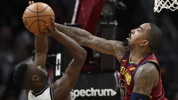 Feb 27, 2018; Cleveland, OH, USA; Brooklyn Nets guard Caris LeVert (22) drives against Cleveland Cavaliers guard JR Smith (5) in the second quarter at Quicken Loans Arena. Mandatory Credit: David Richard-USA TODAY Sports
