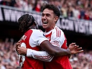 Arsenal's Spanish defender #36 Martin Zubimendi (R) celebrates scoring the team's first goal with Arsenal's English defender #20 Noni Madueke during the English Premier League football match between Arsenal and Nottingham Forest at the Emirates Stadium in London on September 13, 2025. (Photo by HENRY NICHOLLS / AFP) / RESTRICTED TO EDITORIAL USE. No use with unauthorized audio, video, data, fixture lists, club/league logos or 'live' services. Online in-match use limited to 120 images. An additional 40 images may be used in extra time. No video emulation. Social media in-match use limited to 120 images. An additional 40 images may be used in extra time. No use in betting publications, games or single club/league/player publications. /