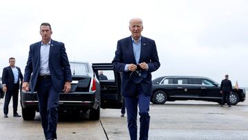 U.S. President Joe Biden walks on the tarmac before boarding Air Force One en route to North and South Carolina, in the wake of Hurricane Helene, at Joint Base Andrews, Maryland, U.S., October 2, 2024. REUTERS/Evelyn Hockstein