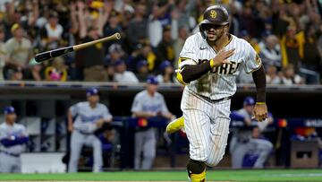 SAN DIEGO, CALIFORNIA - OCTOBER 14: Trent Grisham #2 of the San Diego Padres reacts after hitting a home run against the Los Angeles Dodgers during the fourth inning in game three of the National League Division Series at PETCO Park on October 14, 2022 in San Diego, California.   Harry How/Getty Images/AFP