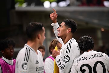 Real Madrid's English midfielder #05 Jude Bellingham celebrates scoring his team's third goal during the UEFA Champions League football match between Atalanta and Real Madrid at the Gewiss Stadium in Bergamo, on December 10, 2024. (Photo by Marco BERTORELLO / AFP)