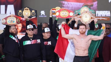Undisputed super middleweight champion Canelo Alvarez poses on stage during his official weigh-in
