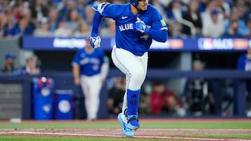 TORONTO, ONTARIO - OCTOBER 12: Anthony Santander #25 of the Toronto Blue Jays hits a single against the Seattle Mariners during the second inning in game one of the American League Championship Series at Rogers Centre on October 12, 2025 in Toronto, Ontario. Mark Blinch/Getty Images/AFP (Photo by MARK BLINCH / GETTY IMAGES NORTH AMERICA / Getty Images via AFP)