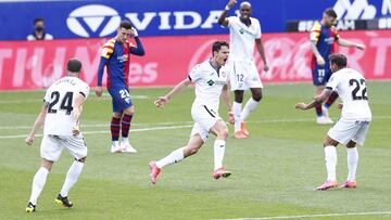 HUESCA, SPAIN - APRIL 25: Enes Uenal of Getafe CF celebrates with Damian Suarez after scoring their side's second goal during the La Liga Santander match between SD Huesca and Getafe CF at Estadio El Alcoraz on April 25, 2021 in Huesca, Spain. Sporti