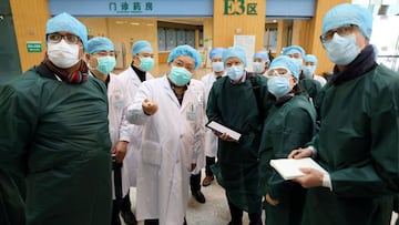 Experts from China and the World Health Organization (WHO) joint team wearing face masks visit the Wuhan Tongji Hospital in Wuhan, the epicentre of the novel coronavirus outbreak, in Hubei province, China February 23, 2020. China Daily via REUTERS ATTENTI