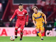 Alexis Vega (L) of Toluca fights for the ball with Francisco Sebastian Cordova (R) of Tigres during the Semi-Final second leg match between Toluca and Tigres UANL as part of the Liga BBVA MX, Torneo Clausura 2025 at Nemesio Diez Stadium on May 17, 2025 in Toluca, Estado de Mexico, Mexico.