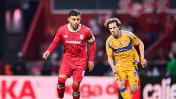 Alexis Vega (L) of Toluca fights for the ball with Francisco Sebastian Cordova (R) of Tigres during the Semi-Final second leg match between Toluca and Tigres UANL as part of the Liga BBVA MX, Torneo Clausura 2025 at Nemesio Diez Stadium on May 17, 2025 in Toluca, Estado de Mexico, Mexico.