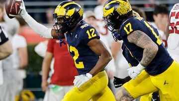 PASADENA, CALIFORNIA - JANUARY 01: Josh Wallace #12 of the Michigan Wolverines celebrates after recovering a fumble in the fourth quarter against the Alabama Crimson Tide during the CFP Semifinal Rose Bowl Game at Rose Bowl Stadium on January 01, 2024 in Pasadena, California.   Kevork Djansezian/Getty Images/AFP (Photo by KEVORK DJANSEZIAN / GETTY IMAGES NORTH AMERICA / Getty Images via AFP)