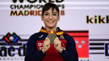 Spain&#039;s Sandra Sanchez Jaime celebrates with her gold medal on the podium after winning the Kata individual female final during the 24th Karate World Championships at the WiZink center in Madrid on November 10, 2018. (Photo by JAVIER SORIANO / AFP)