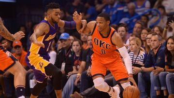 Oct 30, 2016; Oklahoma City, OK, USA; Oklahoma City Thunder guard Russell Westbrook (0) handles the ball against Los Angeles Lakers guard D'Angelo Russell (1) during the first quarter at Chesapeake Energy Arena. Mandatory Credit: Mark D. Smith-USA TODAY Sports