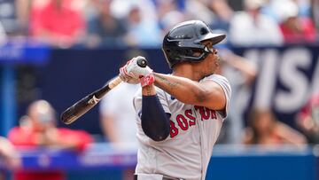 TORONTO, ON - JULY 1: Rafael Devers #11 of the Boston Red Sox hits a two run home run against the Toronto Blue Jays during the third inning in their MLB game at the Rogers Centre on July 1, 2023 in Toronto, Ontario, Canada.   Mark Blinch/Getty Images/AFP (Photo by MARK BLINCH / GETTY IMAGES NORTH AMERICA / Getty Images via AFP)