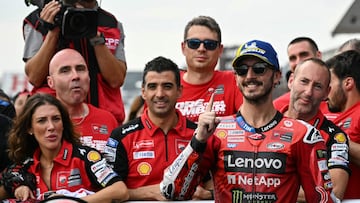 Ducati Lenovo Team's Italian MotoGP rider Francesco Bagnaia celebrates with his team after the MotoGP class race of the MotoGP Japanese Grand Prix at the Mobility Resort Motegi in Motegi, Tochigi prefecture on September 28, 2025. An emotional Marc Marquez clinched his seventh MotoGP world championship and his first since 2019 after finishing second at the Japan grand prix, with Francesco Bagnaia winning the race. (Photo by Toshifumi KITAMURA / AFP)
