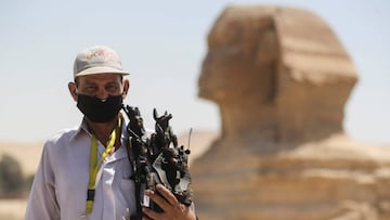 A man wearing a face mask is seen in front of Sphinx at the Great Pyramids of Giza after reopening for tourist visits, following the outbreak of the coronavirus disease (COVID-19), in Cairo, Egypt July 1, 2020. REUTERS/Mohamed Abd El Ghany