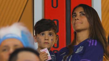 Argentina's forward #10 Lionel Messi's wife Antonela Roccuzzo and son Ciro wait in the tribune for the start of the Qatar 2022 World Cup Group C football match between Poland and Argentina at Stadium 974 in Doha on November 30, 2022. (Photo by Odd ANDERSEN / AFP) (Photo by ODD ANDERSEN/AFP via Getty Images)