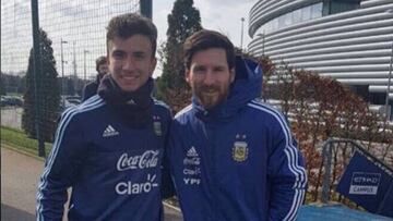 Juan Agüero con Messi.