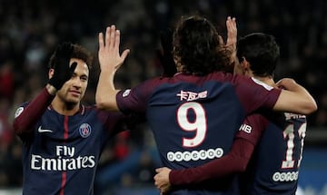 Paris Saint-Germain’s Edinson Cavani celebrates scoring their fifth goal with Angel Di Maria and Neymar