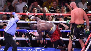 US challenger Deontay Wilder goes down as WBC heavyweight champion Tyson Fury of Great Britain knocks him out in the 11th round of the fight for the WBC/Lineal Heavyweight title at the T-Mobile Arena in Las Vegas, Nevada, October 9, 2021. - Tyson Fury ret