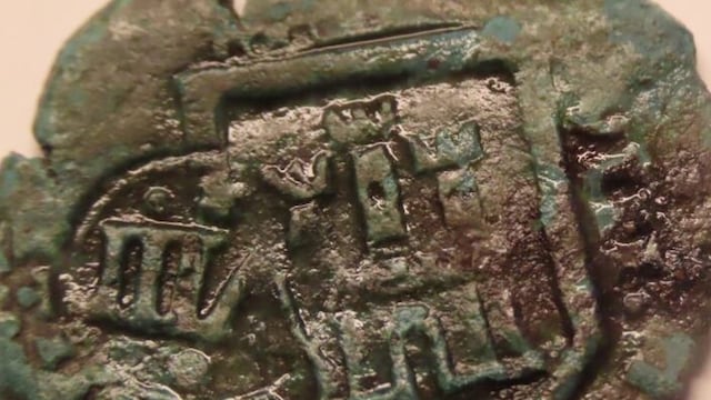 The coin is in a very deteriorated state after spending hundreds of years exposed to the marine ecosystem.
