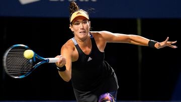 Aug 11, 2022; North York, ON, Canada; Garbine Muguruza (ESP) hits a forehand to Belinda Bencic (not pictured) during third round play of the National Bank Open at Sobeys Stadium. Mandatory Credit: John E. Sokolowski-USA TODAY Sports