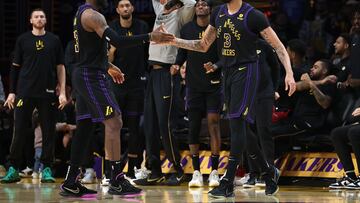 LOS ANGELES, CALIFORNIA - JANUARY 09: LeBron James #23 congratulates Anthony Davis #3 of the Los Angeles Lakers after he drew a foul while shooting during the second half of a game against the Toronto Raptors at Crypto.com Arena on January 09, 2024 in Los Angeles, California. NOTE TO USER: User expressly acknowledges and agrees that, by downloading and or using this photograph, User is consenting to the terms and conditions of the Getty Images License Agreement.   Sean M. Haffey/Getty Images/AFP (Photo by Sean M. Haffey / GETTY IMAGES NORTH AMERICA / Getty Images via AFP)