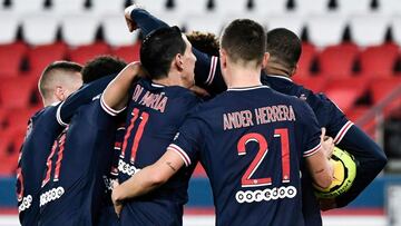 Paris' players celebrate after scoring a goal during the French L1 football match between Paris-Saint Germain (PSG) and RC Strasbourg (RCSA) at The Parc des Princes Stadium in Paris, on December 23, 2020. (Photo by STEPHANE DE SAKUTIN / AFP)