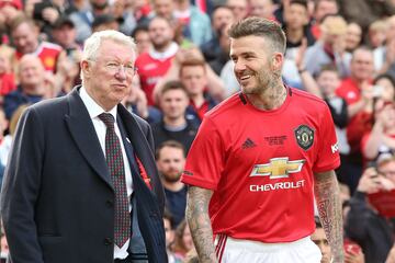 MANCHESTER, ENGLAND - MAY 26:  David Beckham of Manchester United '99 Legends walks out with Manchester United '99 Legends Manager Sir Alex Ferguson prior to the 20 Years Treble Reunion match between Manchester United '99 Legends and FC Bayern Legends at 