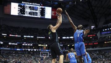 Feb 28, 2018; Dallas, TX, USA; Dallas Mavericks forward Dirk Nowitzki (41) scores his 31000th point over Oklahoma City Thunder forward Jerami Grant (9) during the first half at American Airlines Center. Mandatory Credit: Kevin Jairaj-USA TODAY Sports