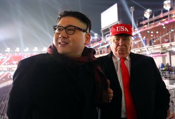 People dressed-up as U.S. President Donald Trump and North Korean leader Kim Jong Un attend the Winter Olympics opening ceremony in Pyeongchang, South Korea February 9, 2018.  Yonhap via REUTERS   ATTENTION EDITORS - THIS IMAGE HAS BEEN SUPPLIED BY A THIR