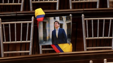 FILE PHOTO: A picture of Colombian Senator Miguel Uribe Turbay of the opposition Democratic Center party hangs from a chair during the opening of the new session of the Colombian Congress, in Bogota, Colombia, July 20, 2025. REUTERS/Luisa Gonzalez/File Photo