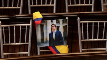 FILE PHOTO: A picture of Colombian Senator Miguel Uribe Turbay of the opposition Democratic Center party hangs from a chair during the opening of the new session of the Colombian Congress, in Bogota, Colombia, July 20, 2025. REUTERS/Luisa Gonzalez/File Photo