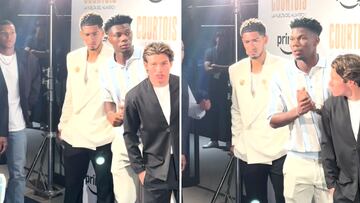 Bellingham's eye-catching outfit steals spotlight at Courtois documentary premiere.