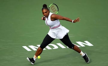 Serena Williams of the United States plays a forehand against Garbine Muguruza
