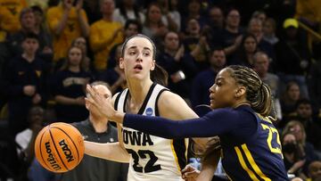 IOWA CITY, IOWA- MARCH 25: Guard Caitlin Clark #22 of the Iowa Hawkeyes goes to the basket during the first half against guard Lauren Fields #23 of the West Virginia Mountaineers during their second round match-up in the 2024 NCAA Division 1 Women's Basketball Championship at Carver-Hawkeye Arena on March 25, 2024 in Iowa City, Iowa.   Matthew Holst/Getty Images/AFP (Photo by Matthew Holst / GETTY IMAGES NORTH AMERICA / Getty Images via AFP)