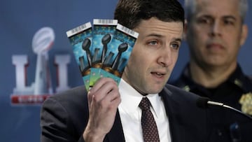 NFL Senior Counsel of Legal Affairs Michael Buchwald holds up Super Bowl 51 tickets as he explains the anti-counterfeit features of legitimate tickets during a news conference for the NFL Super Bowl 51 football game Thursday, Feb. 2, 2017, in Houston. (AP Photo/David J. Phillip)